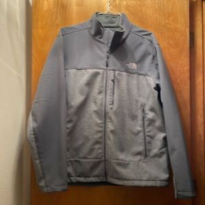 The North Face men’s jacket XL gray heathered with solid gray trim.
